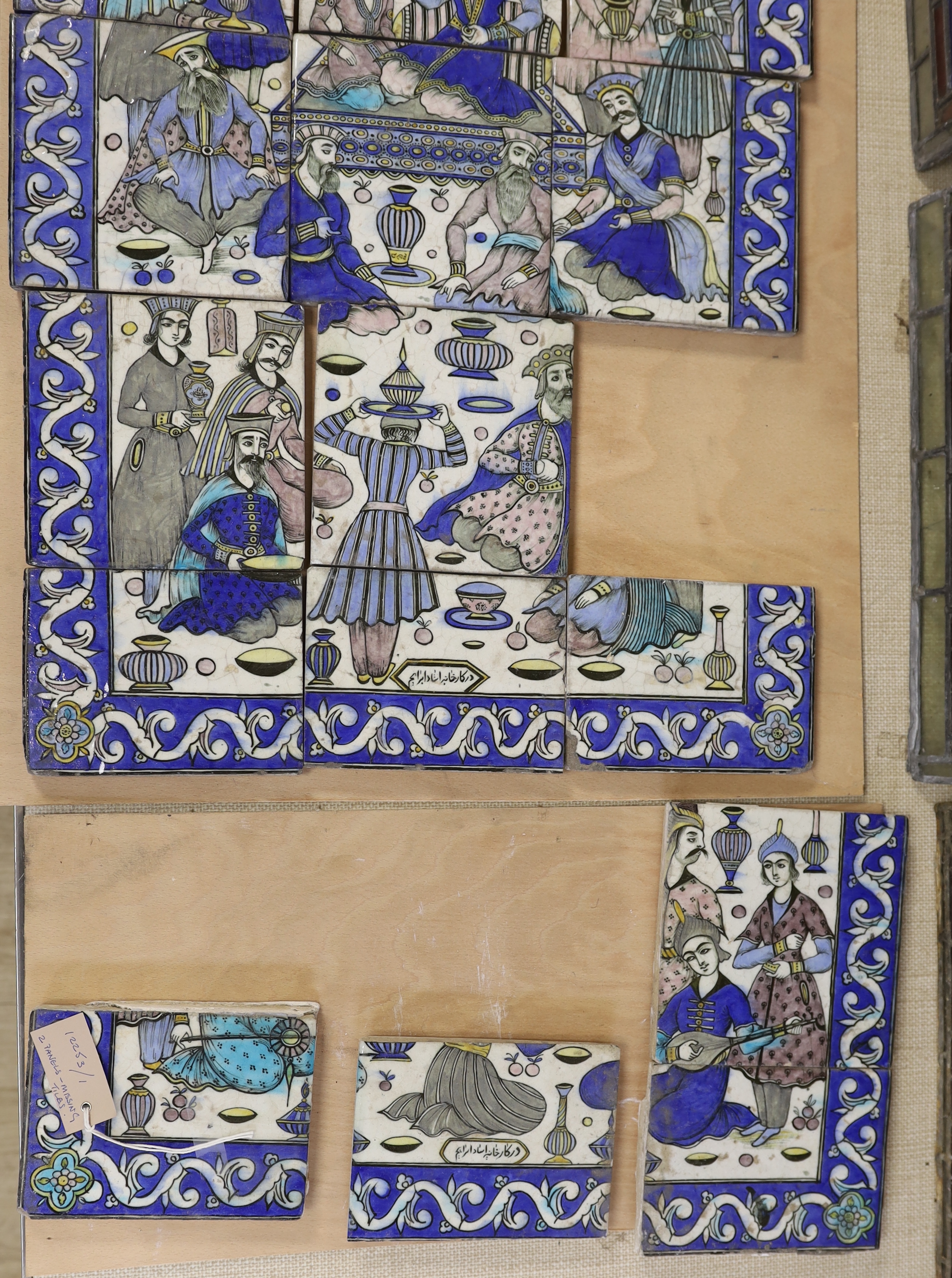 A collection of 20th century Persian tiles as a figurative panel, (two tiles missing) together with four other others from a similar panel, larger panel approximately 86.5cm high x 45cm wide
